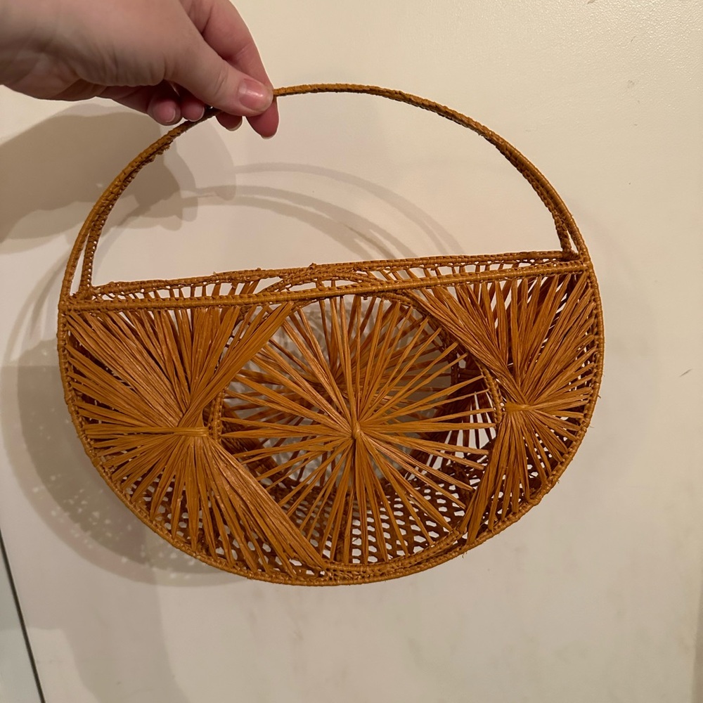 Two Boho Clutch purses. The colors are a deep navy blue and burnt orange.